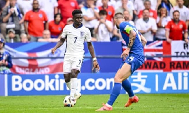 Bukayo Saka stands up Milan Skriniar with the ball at his feet during England v Slovakia